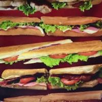 Especial Sandwich · Ham, bacon, cheese, lettuce, tomato, crunched potato chips, garlic sauce.