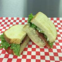 Chicken Salad Sandwich · Homemade chicken salad on lightly toasted bread. Plain or with your choice of lettuce, tomato.