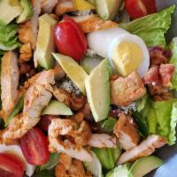 Cobb Salad · Romaine lettuce, tomatoes, crisp bacon, hard-boiled egg, grilled chicken, avocado, cheese, a...