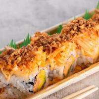 Caribbean Roll · Crab imitation, cucumber, avocado, topped with shredded crab meat imitation,＆  crispy onions.
