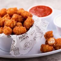 Smokey Tater Tots · Deep-fried grated potatoes with a super crispy and smokey BBQ exterior. Served with marinara...
