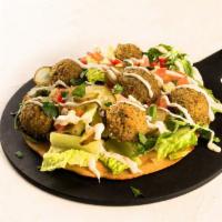 Falafel Salad Pizza · Gluten free crust, romaine lettuce, israeli salad, sour pickles, RR falafel balls, tahini dr...