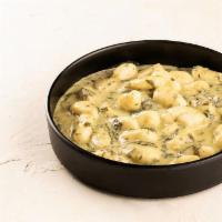 Gnocchi Ai Funghi · Pan seared tender potato dumplings, bianca sauce, with a choice of: Wild Mushrooms, or Cream...