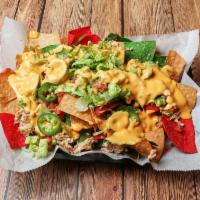 Chicken Nachos · Shredded chicken, shredded lettuce, tomato, jalapenos, salsa, sour cream. Add guacamole for ...