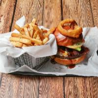 Rodeo Burger · Certified Angus beef, BBQ sauce, brown sugar bacon, cheddar cheese, onion rings.