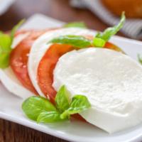 Caprese Salad · Mixed greens, fresh mozzarella, tomatoes, basil, balsamic vinaigrette.