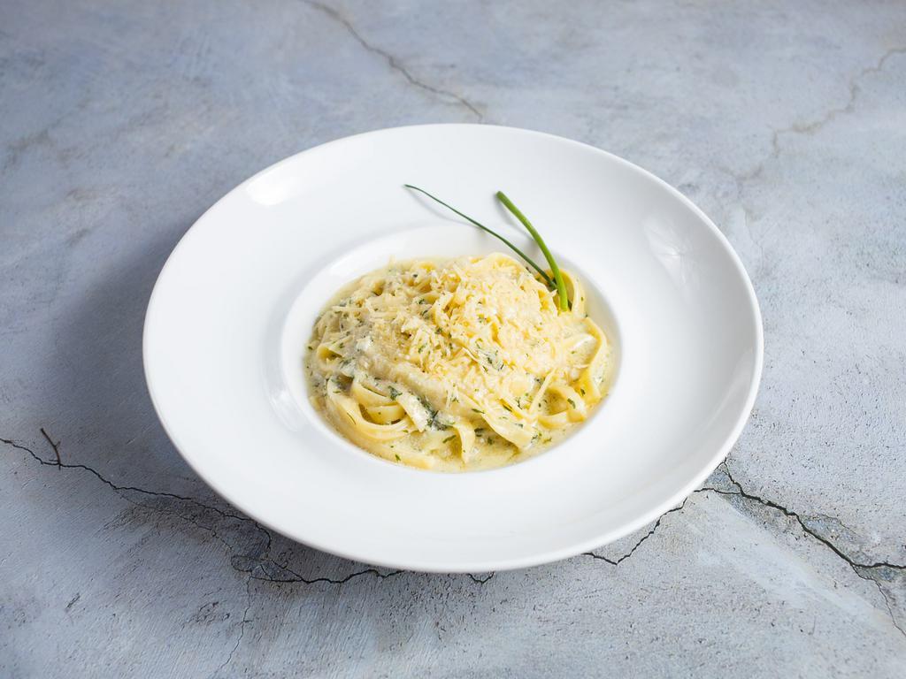 Are you Alfredo of the Dark · Don’t share this with your brother; our delicious fettuccine pasta is cooked in a creamy white sauce and topped with aged Parmesan. Sure to make you look smart. Vegetarian.