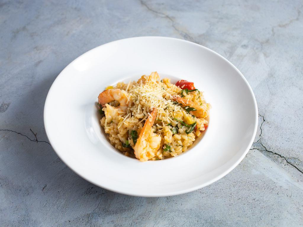 Prawn & Preserved Lemon Risotto · Tender Arborio rice simmered with jumbo prawns and house made preserved lemons and a touch of fresh herbs, finished with Parmesan cheese.