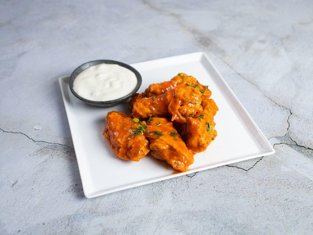Buffalo Chicken Wings · Our homemade crispy chicken wings are a crowd favorite. Served with blue cheese. Six pieces.