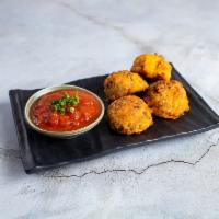 Sausage Puffs · Get some sausage puffs with your meal served with marinara sauce. Four pieces.