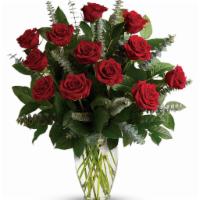 Dozen Red Long Stem Roses  · Vase of 12 roses with babies breath and mixed greens.