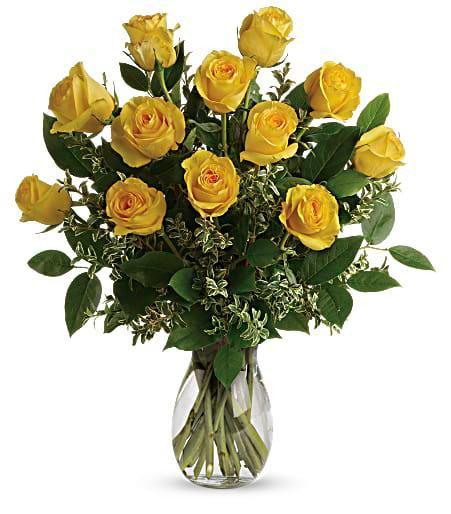 Dozen Yellow Long Stem Roses  · Vase of 12 roses with babies breath and mixed greens.