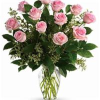 Dozen Pink Long Stem Roses  · Vase of 12 roses with babies breath and mixed greens.