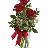 3 Red Roses in a Bud Vase  · Vase of 6 roses with babies breath and mixed greens.
