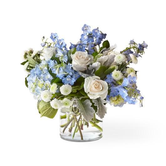 Clear Skies Bouquet · A garden mix of seasonal flowers in a vase.