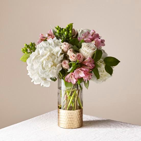 Rose' All Day Bouquet · A mix of garden flowers in a vase.