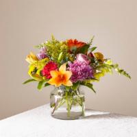 FTD Party PunchBouquet · Garden style vase of flowers.
