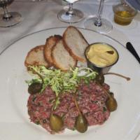 Steak Tartare · Hand chopped filet Mignon and classic sauce.
