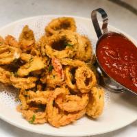 Crispy Fried Calamari · Cherry peppers & spicy tomato dipping sauce.