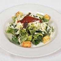 Caesar Salad · Romaine hearts with classic Caesar dressing & anchovies.