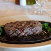 New York Steak · 16 oz., prime aged 28 days, sizzled with shallots and butter.