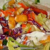 Garden Salad · Iceberg mix, carrots, cucumbers, tomatoes, and grated cheddar.