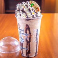 Cookie Monster · Chocolate chip cookie, chocolate, coffee syrup, dairy, blended with ice, topped with whipped...