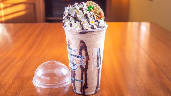 Cookie Monster · Chocolate chip cookie, chocolate, coffee syrup, dairy, blended with ice, topped with whipped cream.