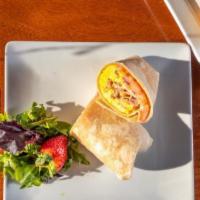 The Brewed Wrap Egg Sandwich · 2 farm fresh eggs with ham, tomato, onion,  and American Cheese on a white wrap.
