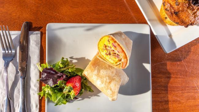 The Brewed Wrap Egg Sandwich · 2 farm fresh eggs with ham, tomato, onion,  and American Cheese on a white wrap.