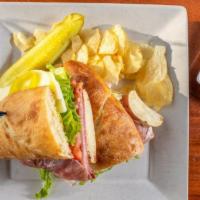 Italian Grinder · Cold-cuts, provolone, lettuce, tomato, hot peppers, and oil & vinegar on your choice of brea...