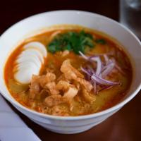 Coconut Chicken Noodle Soup · Rich in coconut milk soup served with chicken, egg noodles, hard boiled-egg cilantros, fresh...