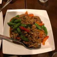 Lemongrass Pork · Wok stir-fried with lemongrass, snap peas, garlic, soy sauce, red bell peppers and finished ...