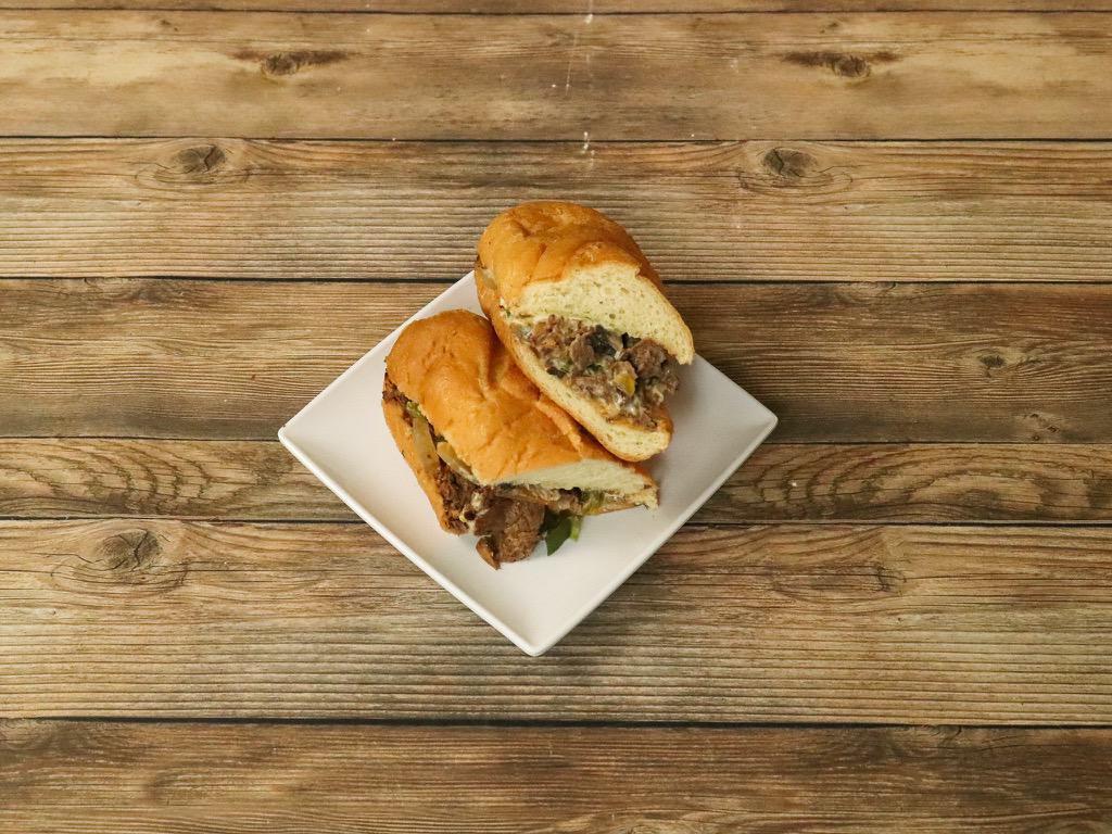Philly Cheesesteak Sandwich · Real sirloin steak with American cheese, grilled onions, mushrooms and green peppers on a hoagie roll.