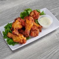 Chicken Wings · House-made, choice of ranch, blue cheese, BBQ or Buffalo sauce. Extra sauce for an additiona...