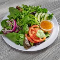 Tossed Green Salad · Mixed greens, cucumber, red onion, tomatoes and green bell peppers. Choice of Italian, Caesa...