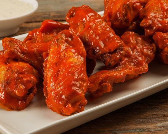 Bone-In Wings · 1 pound.  Crispy on the outside, plump and juicy on the inside. Our Wings are tossed in your favorite sauce and served with your choice of dipper.