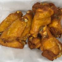 A8. Chicken Wings · 8 wings. Cooked crispy marinated chicken wings