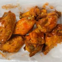 A10. Buffalo Wings · 8 wings. Cooked wing of a chicken coated in Buffalo sauce. Hot and spicy.