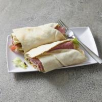 Greek Pita · Served with ham, salami, onions, feta cheese, black olives, pepper rings, lettuce, tomatoes,...