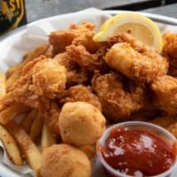 Shrimp Basket · Seasoned jumbo gulf shrimp lightly battered and fried or grilled. Served with Cajun fries, h...