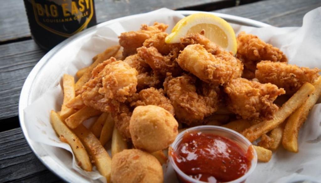 Shrimp Basket · Seasoned jumbo gulf shrimp lightly battered and fried or grilled. Served with Cajun fries, hush puppies, and cocktail sauce.