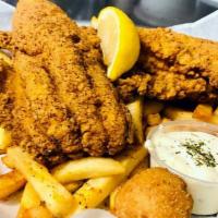Catfish Basket · Boneless filet fried golden brown or grilled. Served with Cajun fries, hush puppies, and tar...