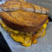 39th St. Patty Melt · 1/2 lb Fresh Burger on Marble Rye w/ Grilled Onions & 
Cheddar Cheese