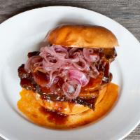 Smoked BBQ Brisket Sandwich · Smoked Brisket w/BBQ Sauce On Brioche Bun w/ Pickled Onions