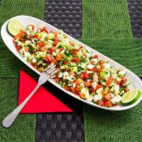 Arabic Salad · Chopped tomatoes, cucumbers, scallions, parsley, onions, extra virgin olive, lemon and herbs.