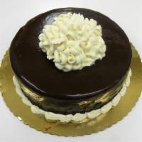 Chocolate Decadence Torte · 2 layers of rich chocolate cake and layers of chocolate mousse
glazed in dark chocolate. Gar...