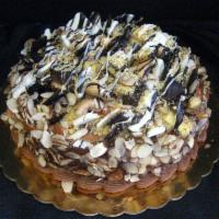 Rocky Road Torte · Chocolate cake layered with chocolate mousse, frosted in
chocolate buttercream and covered w...