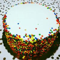 10” Partyfetti Cake · Serves 15-18. White cake with sprinkles baked in covered with white buttercream and festive ...