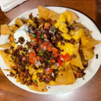 Nachos with Meat · Tortilla chips with cheese,pico de Gallo sour cream, jalapenos and your choice of meat. Plea...